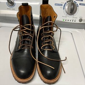 Black cap toe leather boots